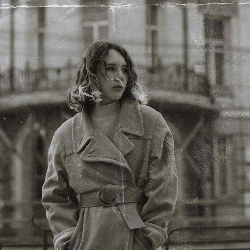 girl standing in vintage coat 