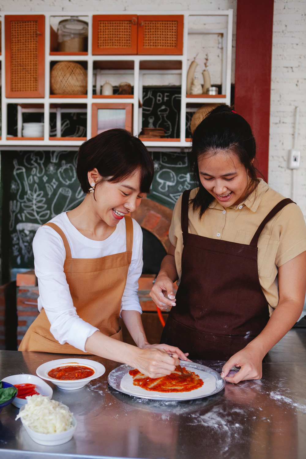 Women making pizza
